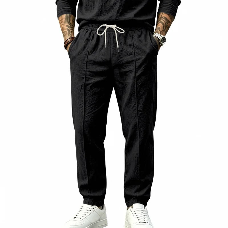 Men's Textured Tapered Drawstring Trousers. Textured finish.