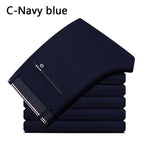 Men's Lightweight Slim Stretch Dress Trousers. Polyester and elastane blend.