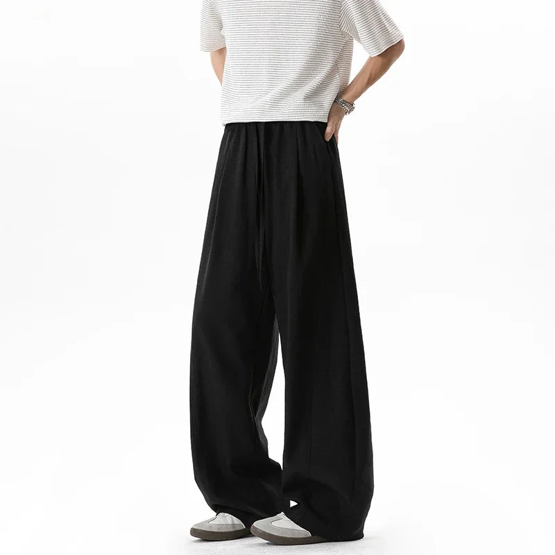 Men's Linen-Look Textured Wide-Leg Trousers. Polyester fabric with a linen-look texture.