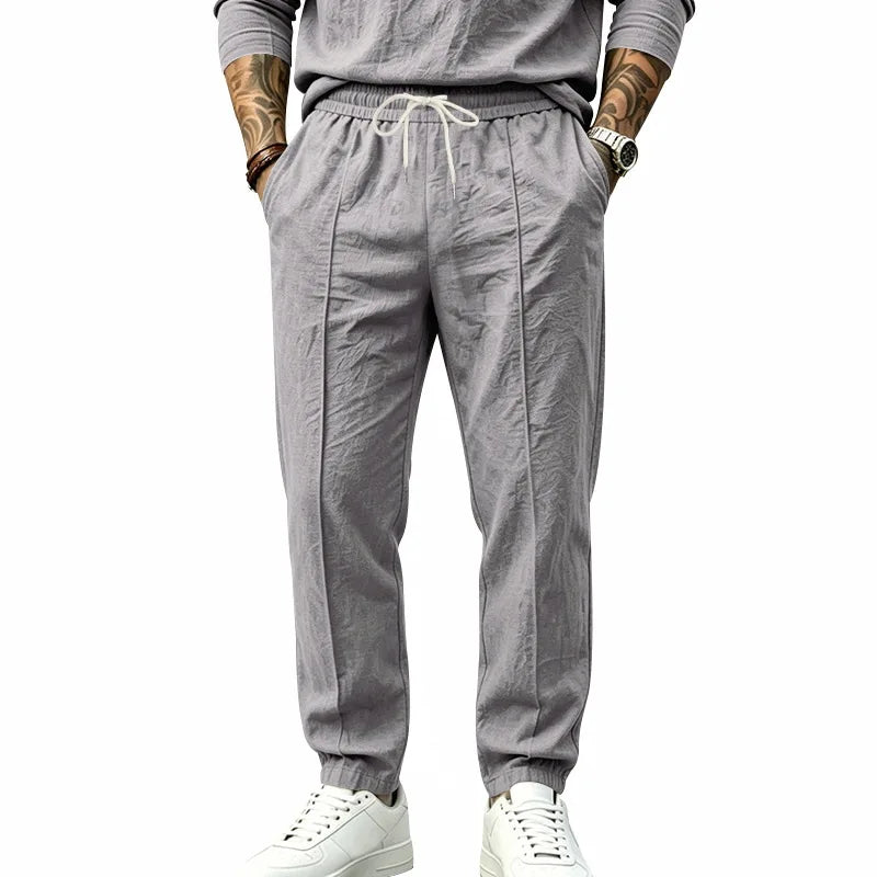 Men's Textured Tapered Drawstring Trousers. Textured finish.