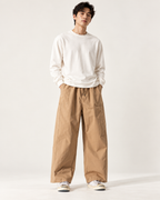 Relaxed wide-leg trousers in Stone — model view