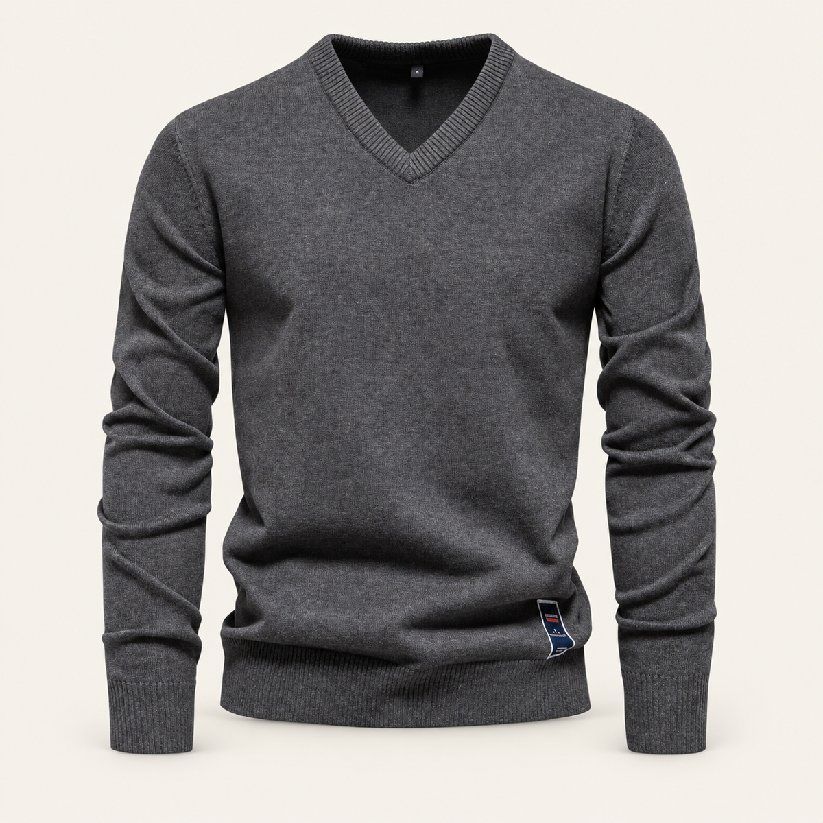 Studio view of knitwear on an ivory background