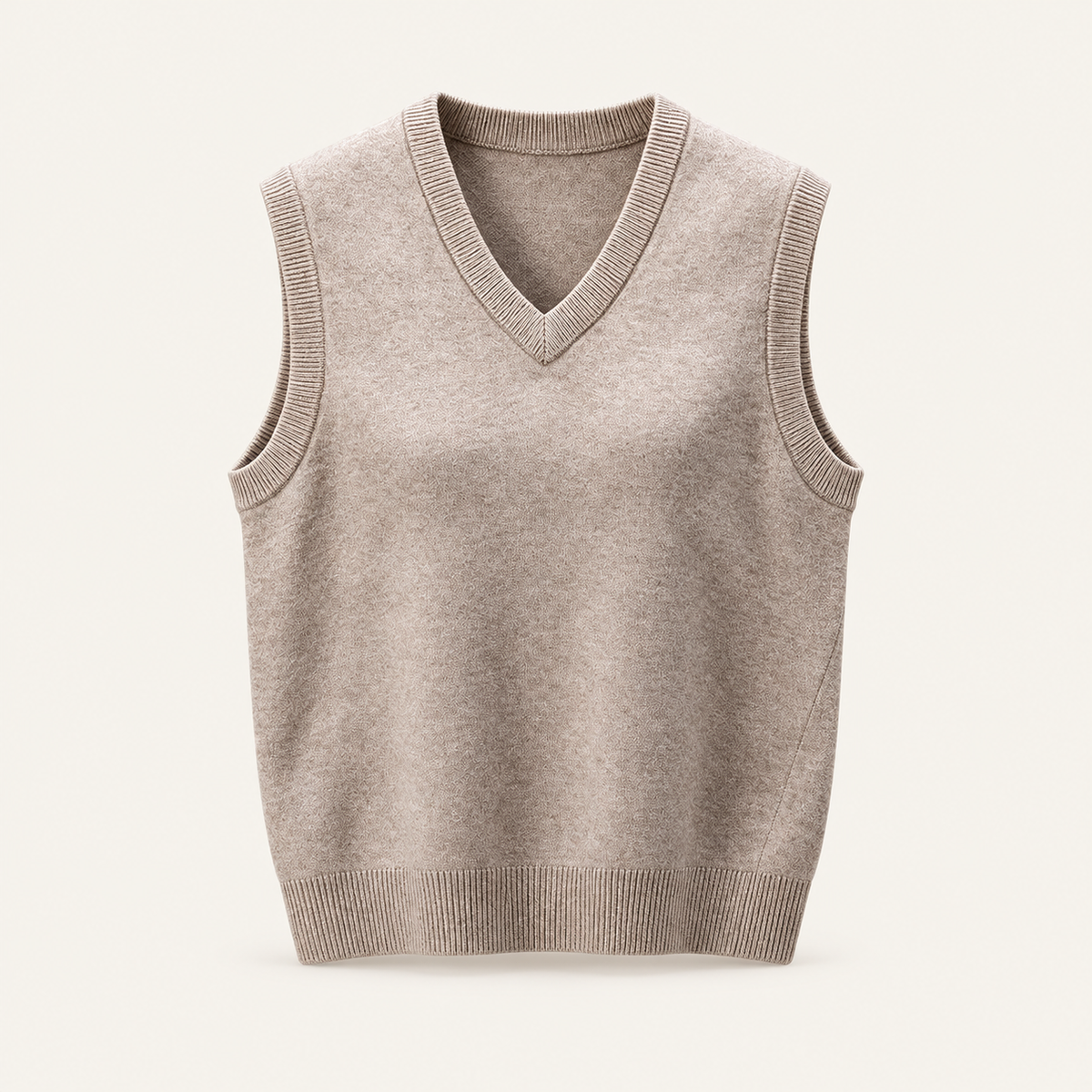 Studio view of knitwear on an ivory background