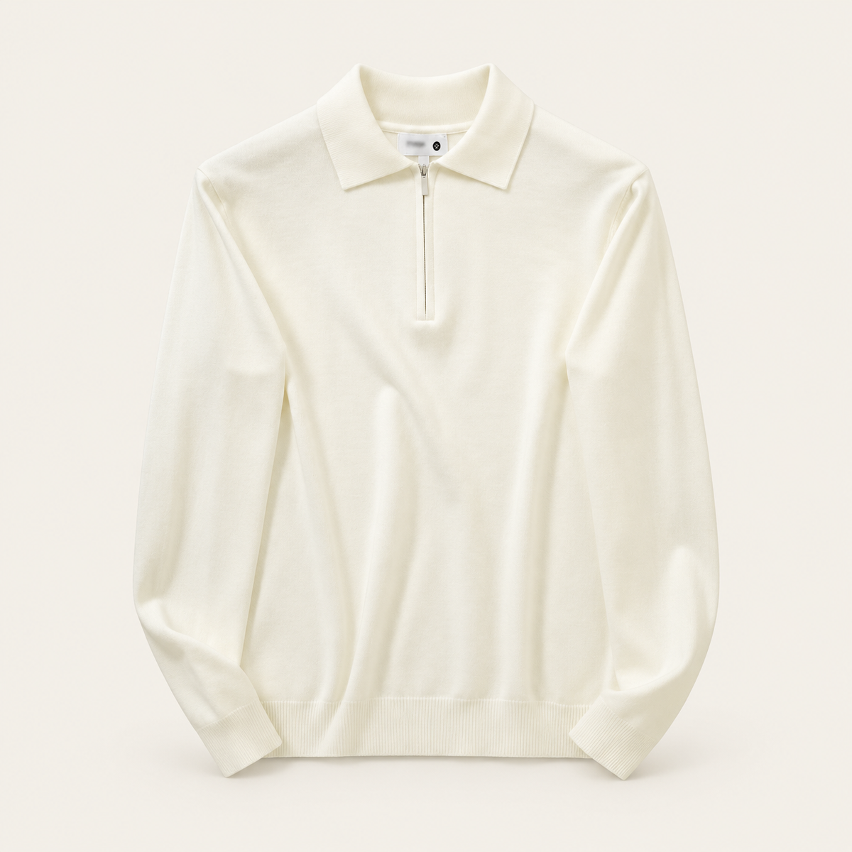 Studio view of knitwear on an ivory background