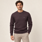 Model wearing knitwear in a neutral studio