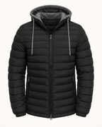 Hooded quilted puffer — studio photograph